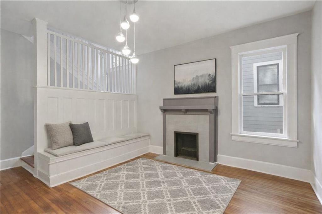 693 Myrtle Street Northeast, Unit 2 Atlanta, GA 30308 - Photo 5 of 17 a living room with furniture and a fireplace