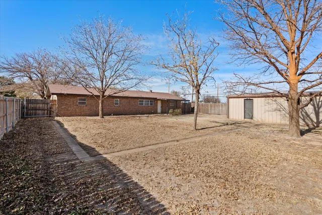 a view of a yard covered with snow in the background
