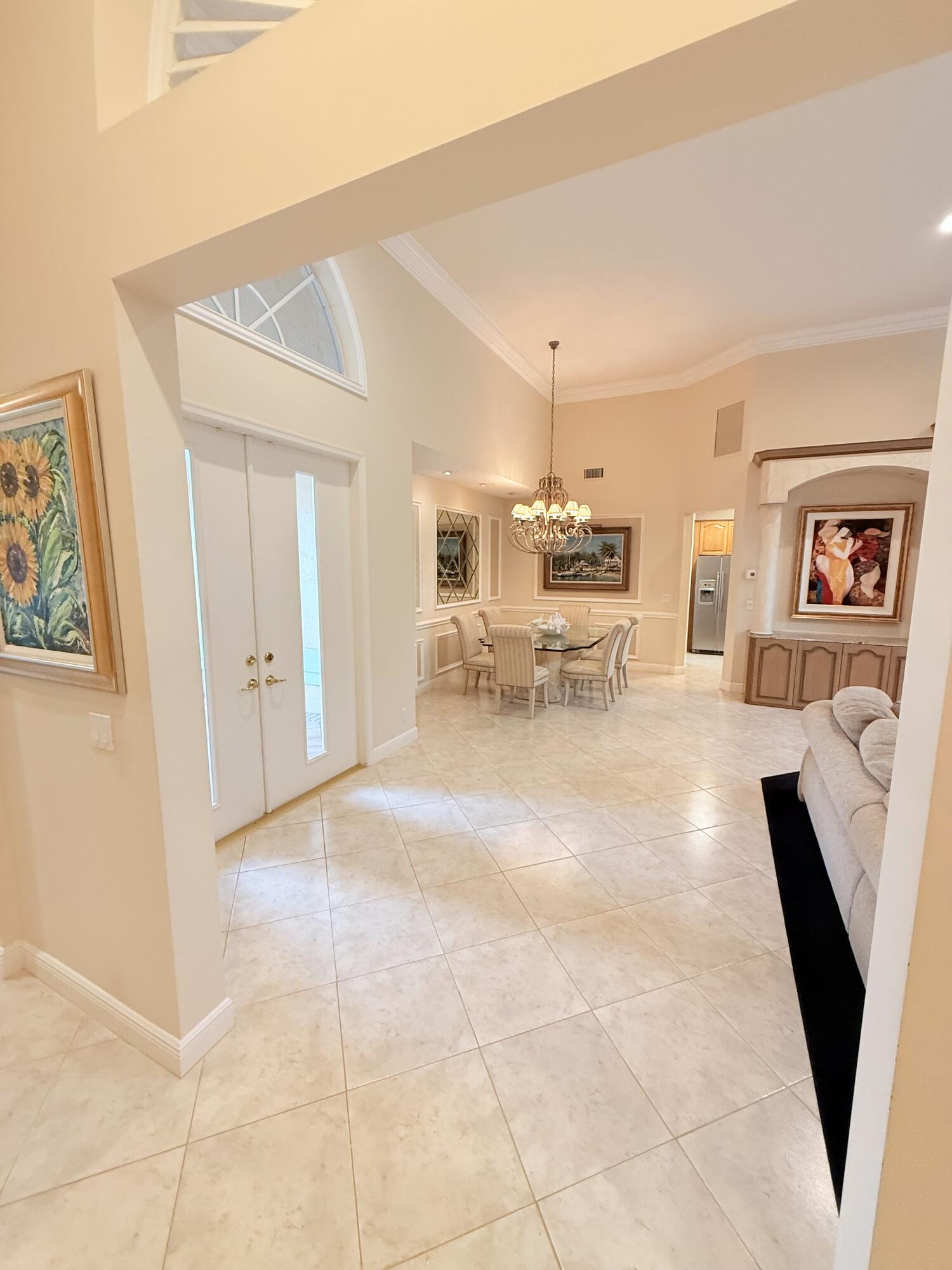 7633 La Corniche Circle Boca Raton, FL 33433 - Photo 2 of 49 a living room with furniture and a fireplace