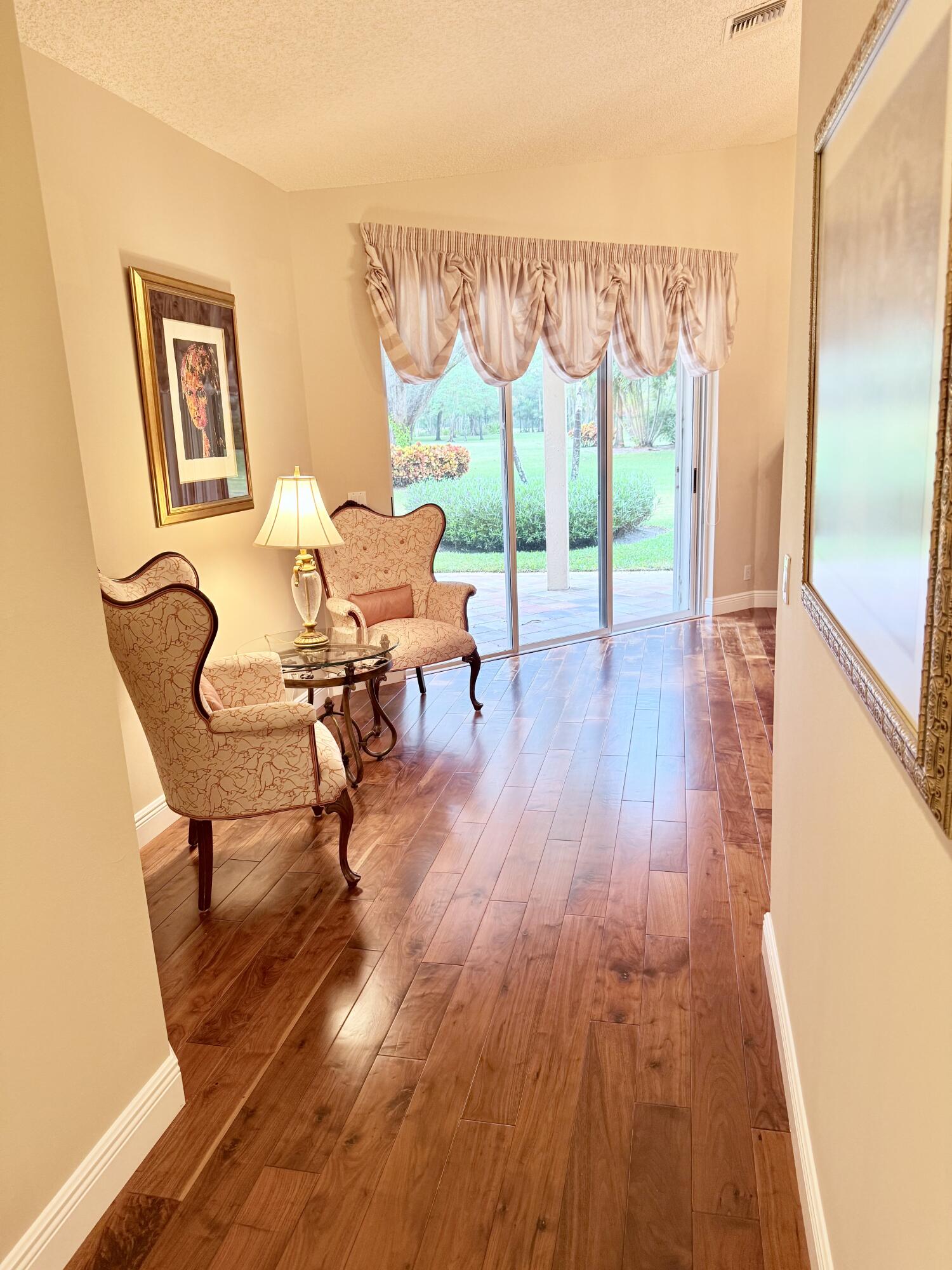 7633 La Corniche Circle Boca Raton, FL 33433 - Photo 27 of 49 a living room with furniture and a wooden floor