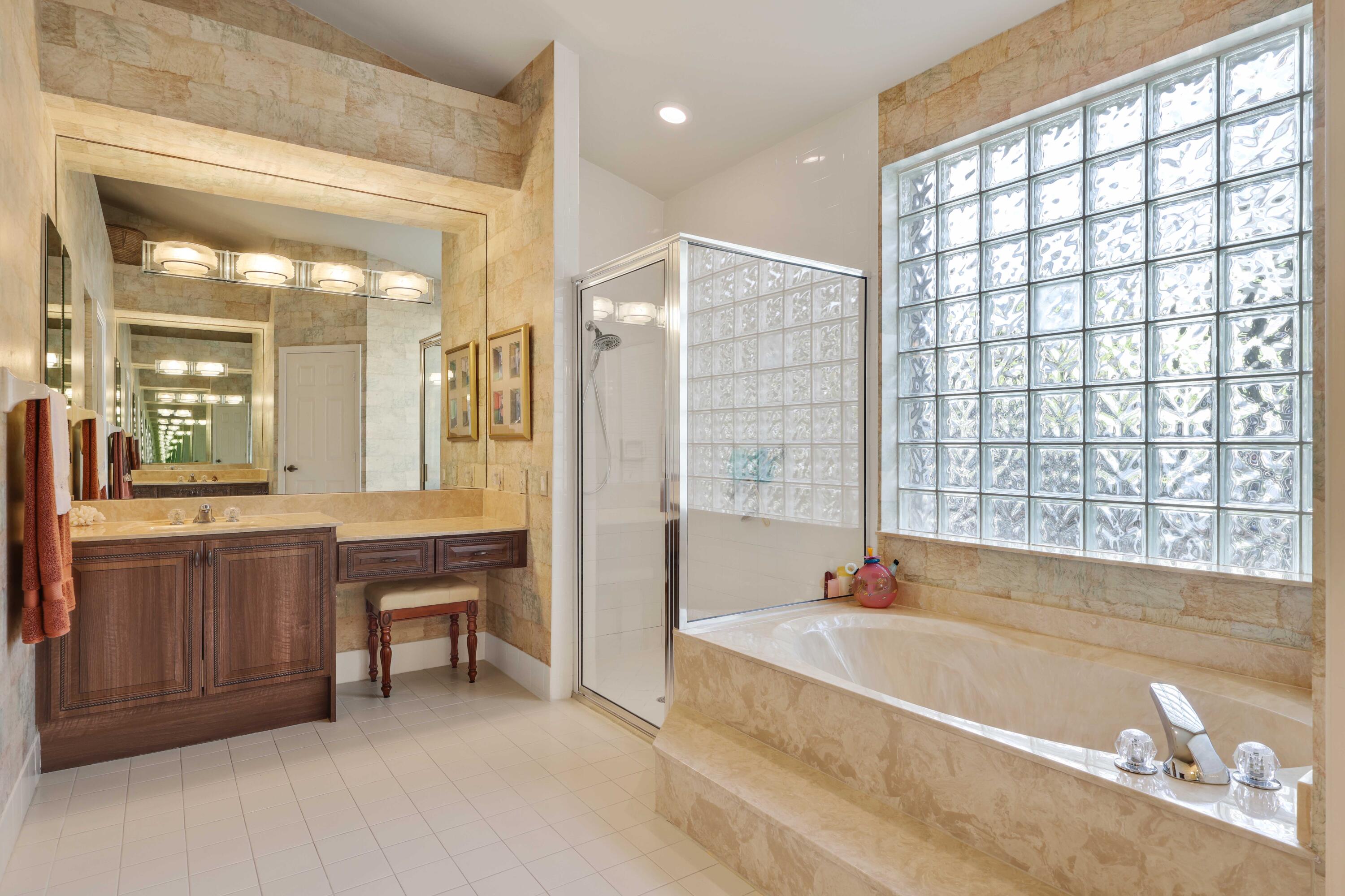 7633 La Corniche Circle Boca Raton, FL 33433 - Photo 33 of 49 a spacious bathroom with a large tub and shower