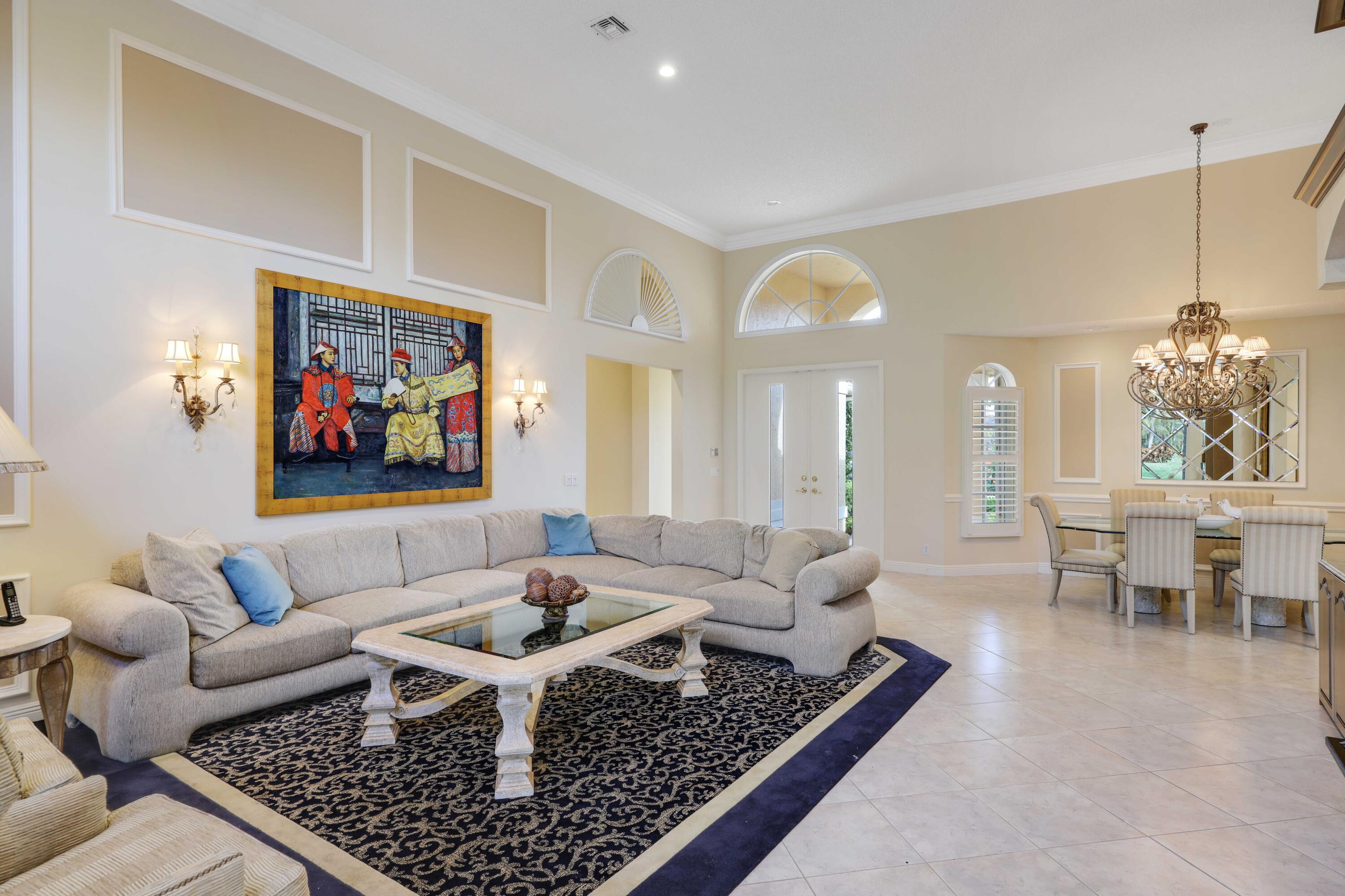 7633 La Corniche Circle Boca Raton, FL 33433 - Photo 7 of 49 a living room with furniture and a chandelier