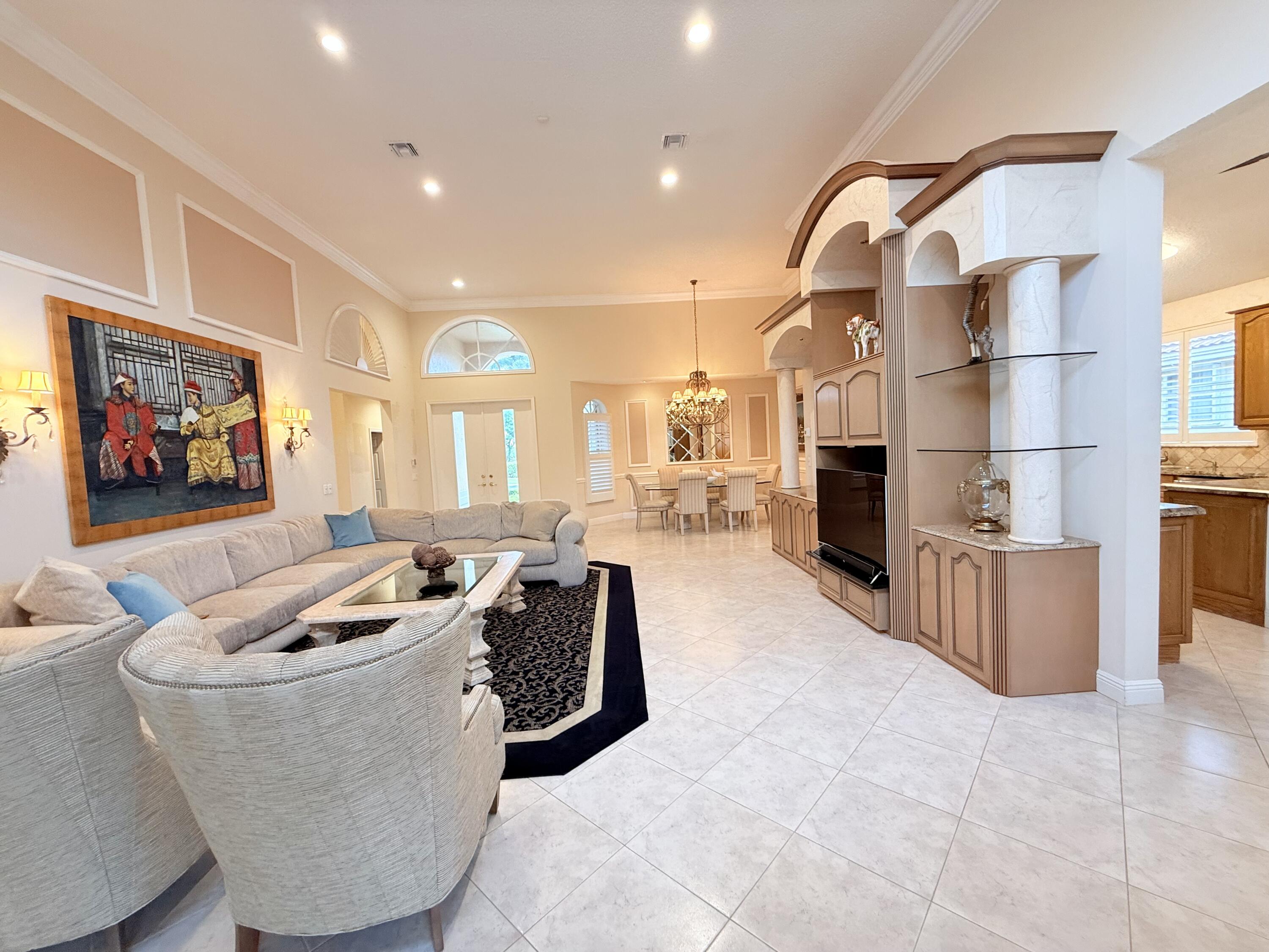 7633 La Corniche Circle Boca Raton, FL 33433 - Photo 10 of 49 a living room with fireplace furniture and a flat screen tv