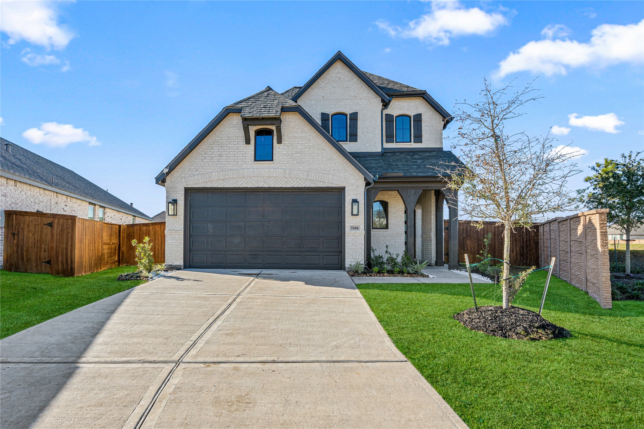 5106 Sistine Drive Manvel, TX 77578 - Photo 1 of 42 a front view of a house with a yard and garage