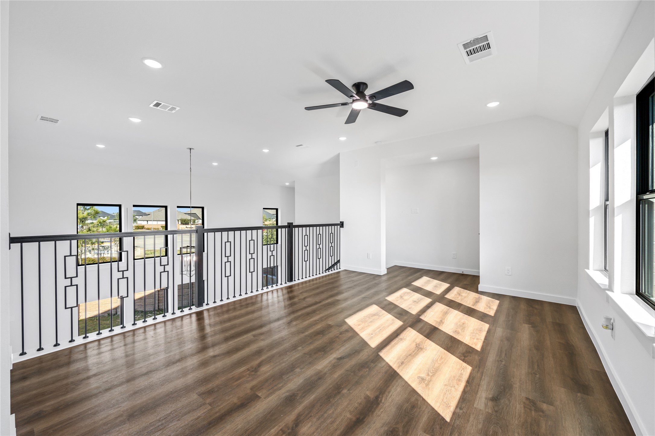 5106 Sistine Drive Manvel, TX 77578 - Photo 14 of 42 a view of empty room with wooden floor and fan