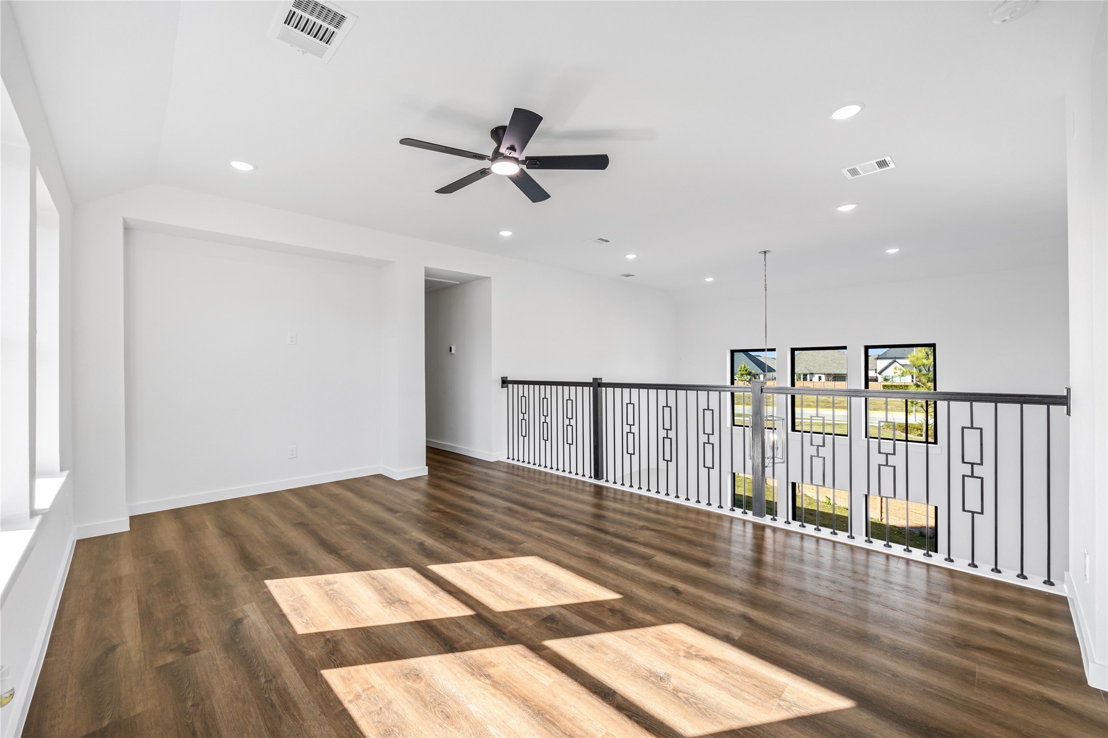 5106 Sistine Drive Manvel, TX 77578 - Photo 15 of 42 a view of a hallway with wooden floor