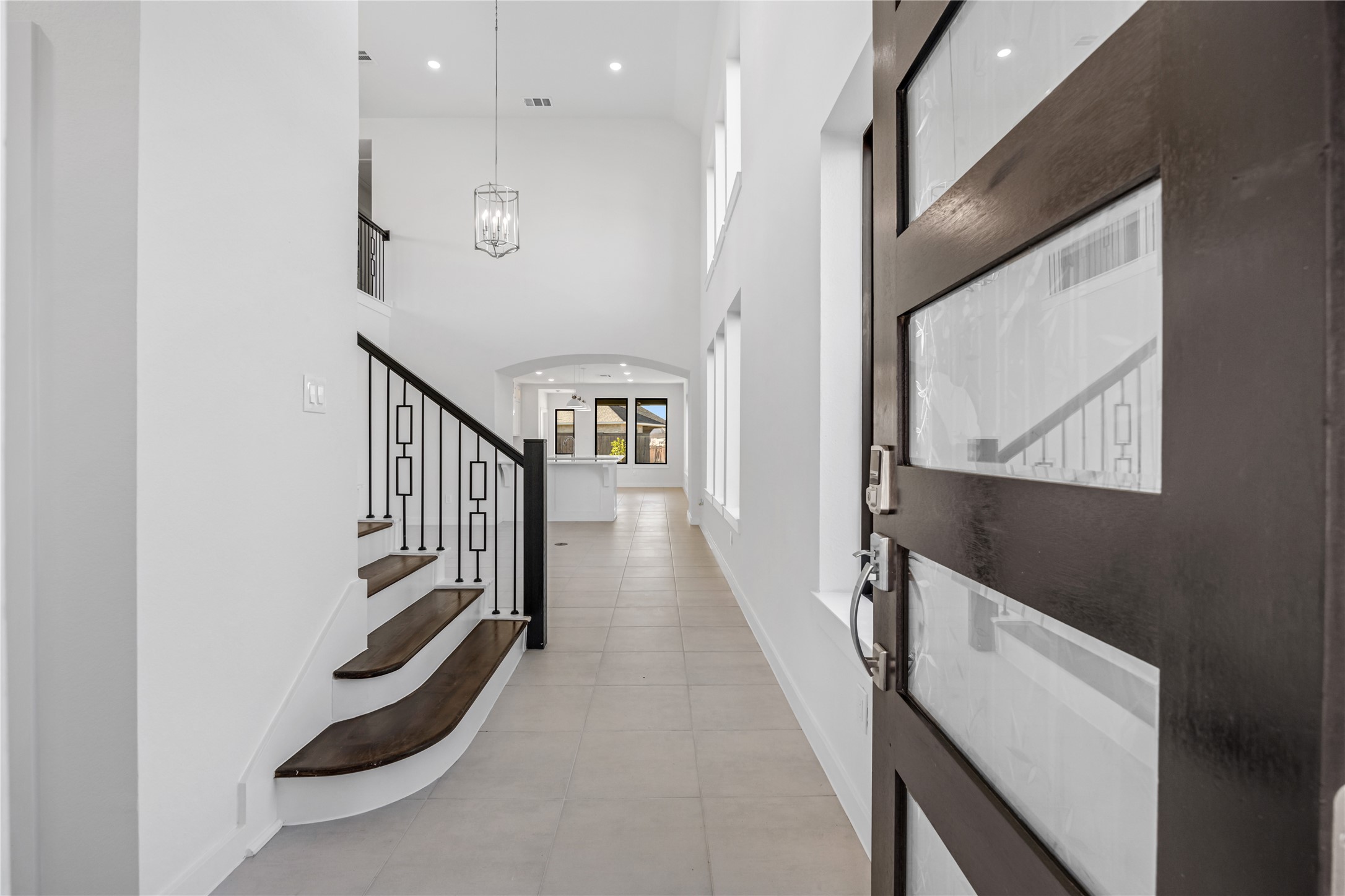 5106 Sistine Drive Manvel, TX 77578 - Photo 4 of 42 a view of a hallway with wooden floor and staircase