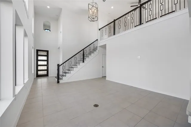 a view of entryway and hall with stairs