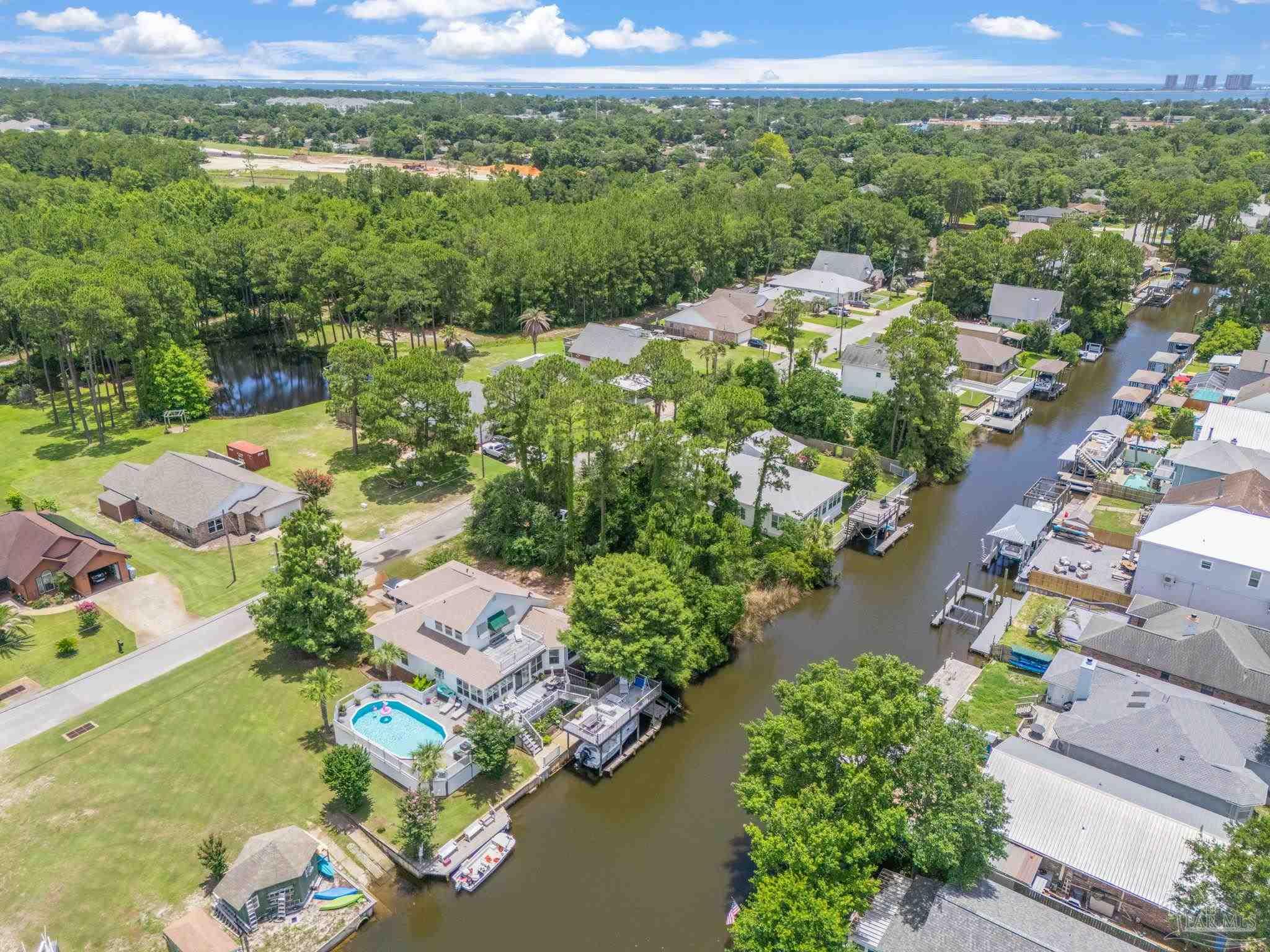 Lot 19 Stanford Road Gulf Breeze, FL 32563 - Photo 5 of 6 an aerial view of a city with lots of residential buildings and mountain view in back