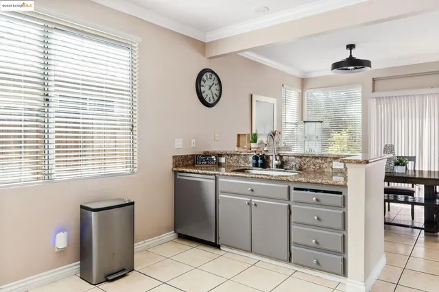 a kitchen with sink cabinets and window