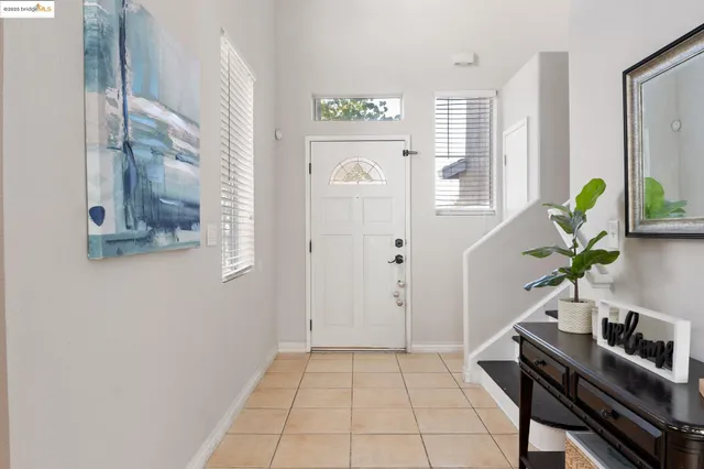 a view of an entryway with wooden floor