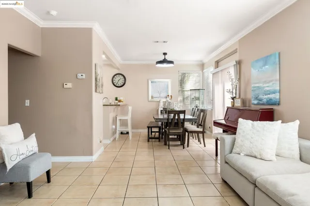 a living room with furniture and a clock