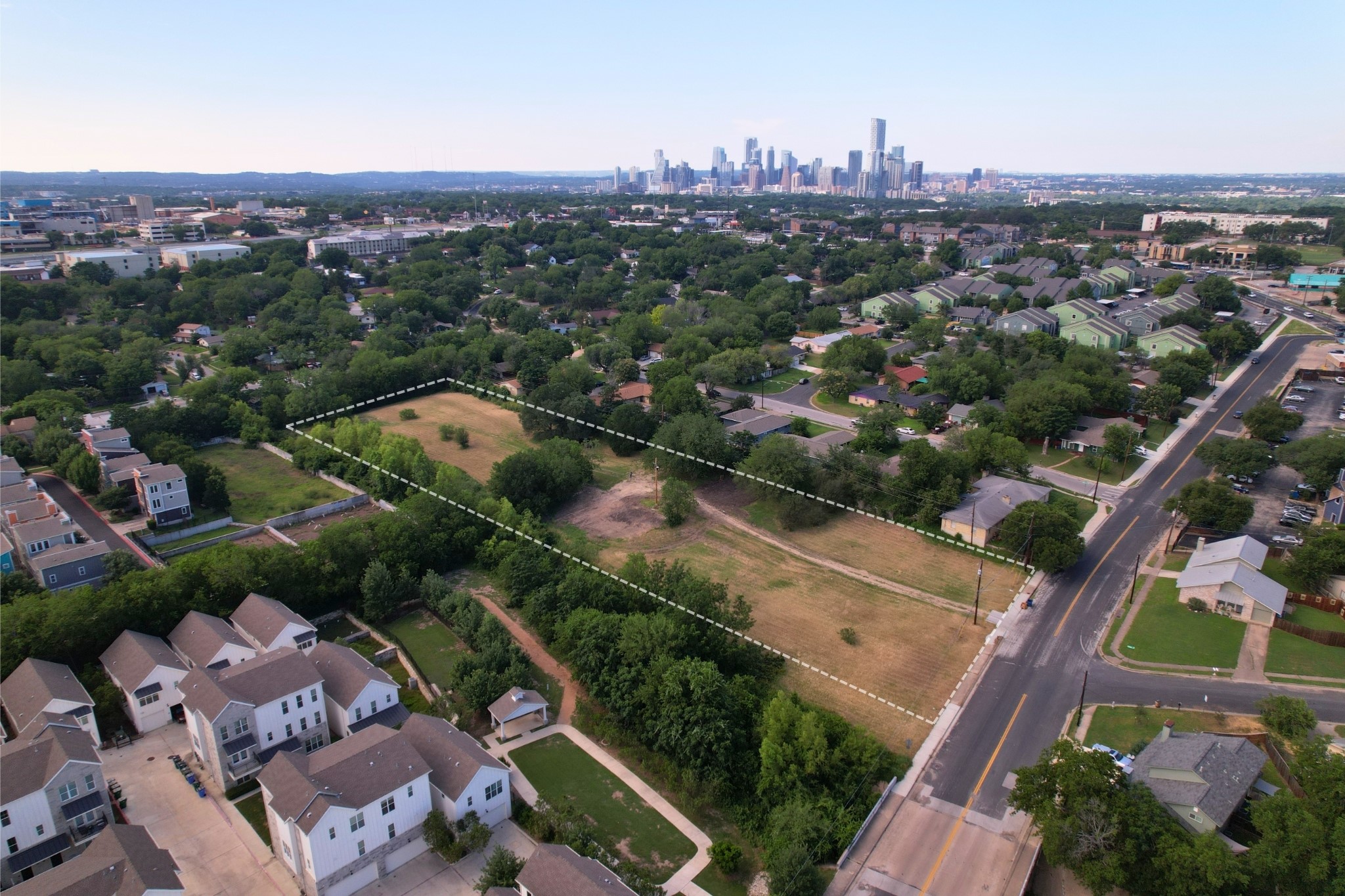 2610-2606 Metcalfe Road Austin, TX 78741 - Photo 15 of 20 Discover a spacious lot with a distant city skyline view, perfect for future development.