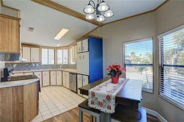a very nice looking dining room with furniture window and wooden floor