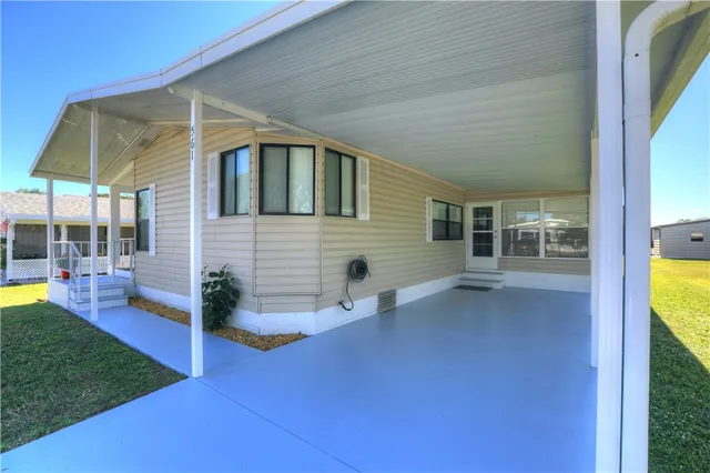 a view of house with backyard porch and living room