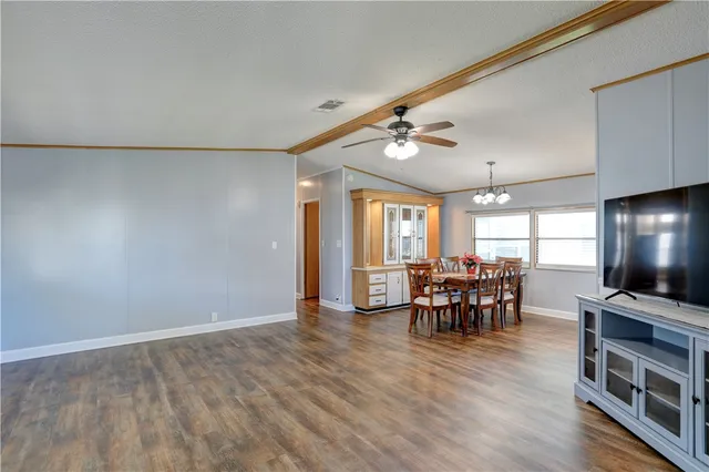 a view of a dining room with furniture and window