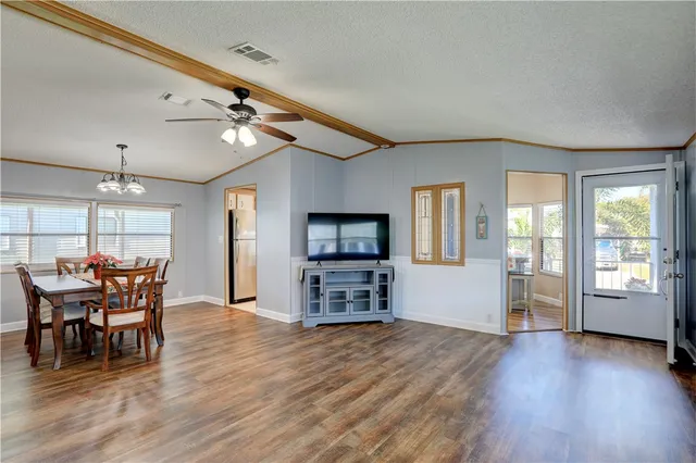 a view of a livingroom with furniture window and wooden floor