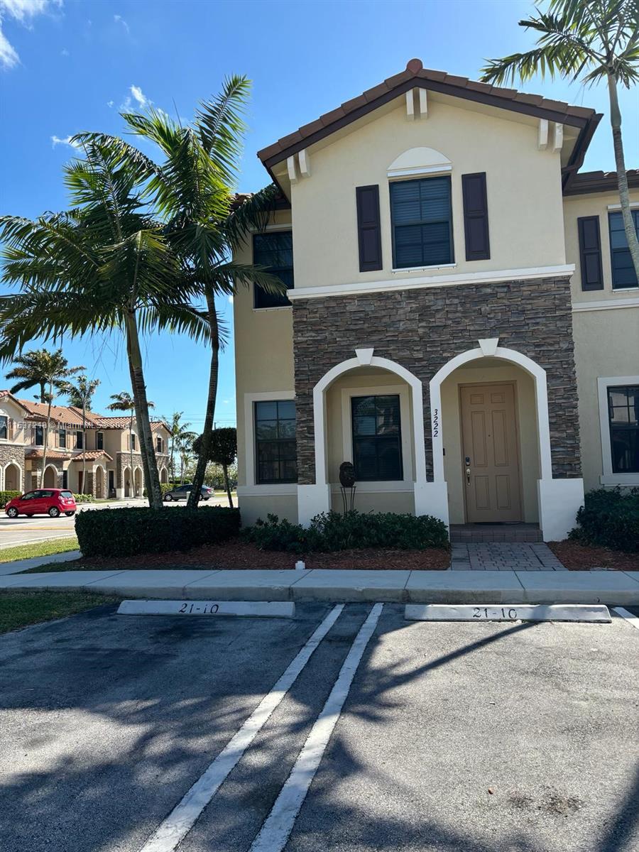 Oasis Homestead, FL 33033 - Photo 2 of 12 a front view of a house with yard