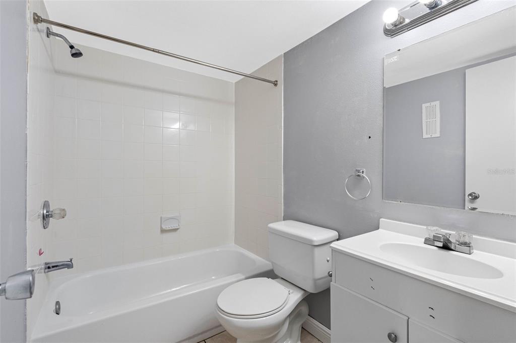5820 North Church Avenue, Unit 346 Tampa, FL 33614 - Photo 14 of 30 a bathroom with a sink toilet and shower