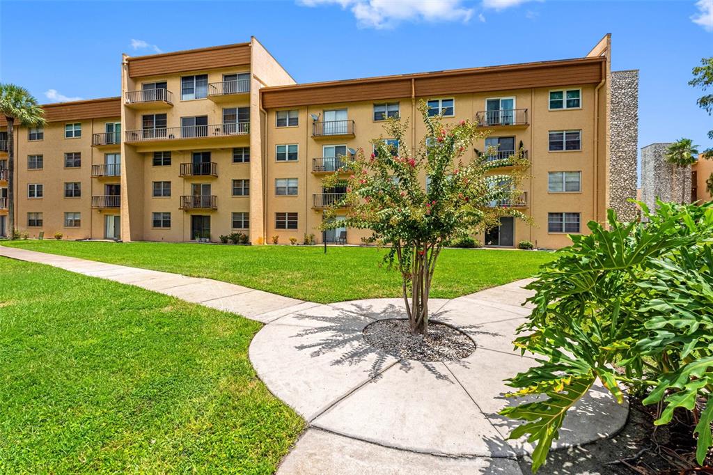5820 North Church Avenue, Unit 346 Tampa, FL 33614 - Photo 21 of 30 a view of a building with garden