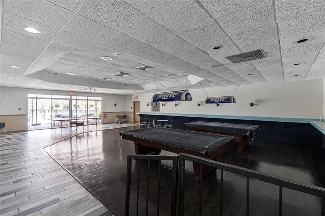 a kitchen with a table chairs stove and cabinets