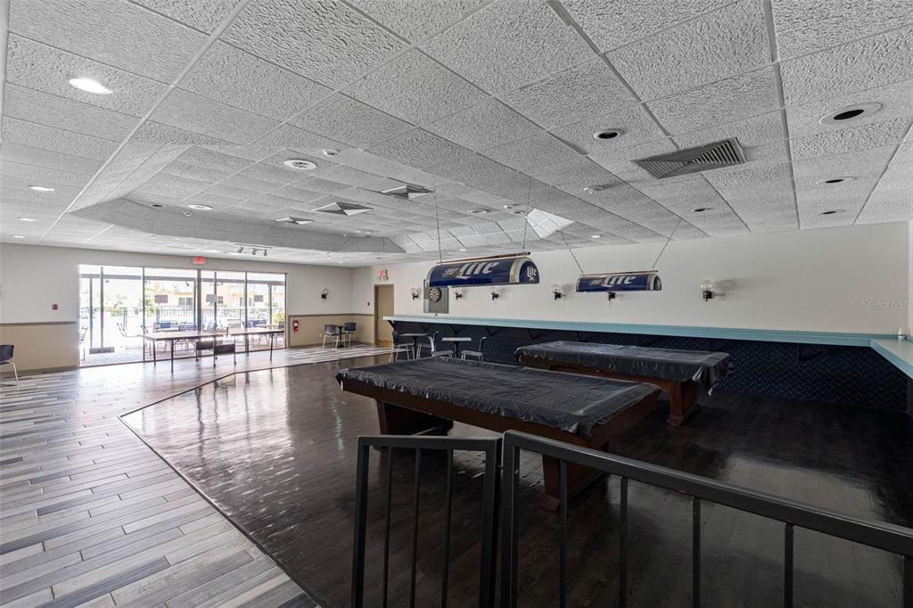 5820 North Church Avenue, Unit 346 Tampa, FL 33614 - Photo 30 of 30 a kitchen with a table chairs stove and cabinets