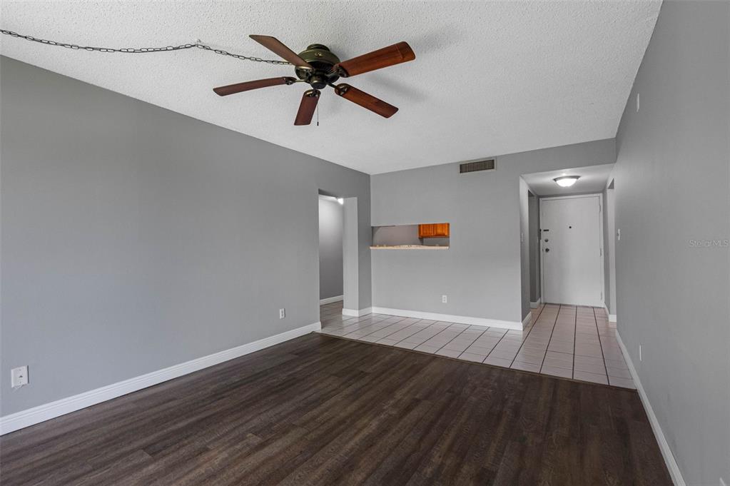 5820 North Church Avenue, Unit 346 Tampa, FL 33614 - Photo 9 of 30 an empty room with wooden floor and windows