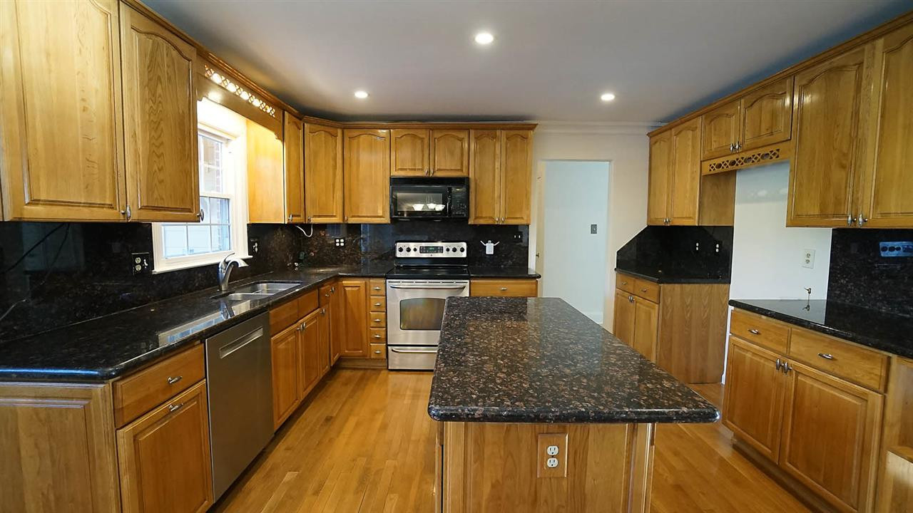 1809 Pony Run Road Raleigh, NC 27615 - Photo 6 of 30 Updated kitchen with granite counter and backsplash Kitchen