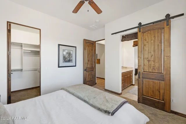 a bedroom with a bed and a walk in closet