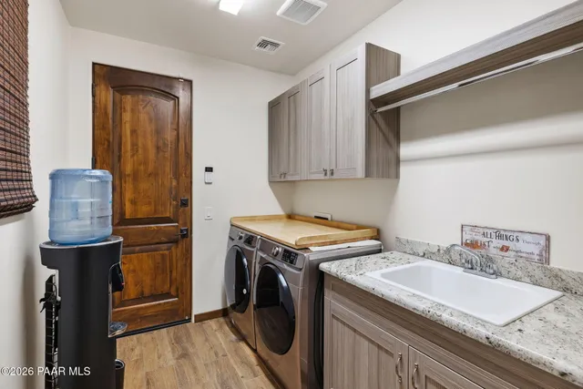 a view of a house with backyard and porch