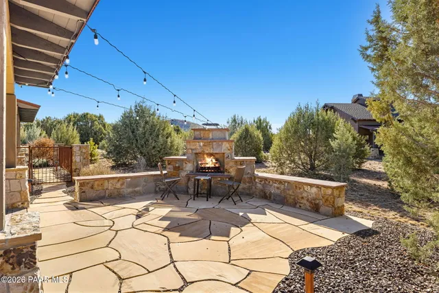 a view of backyard with sitting area