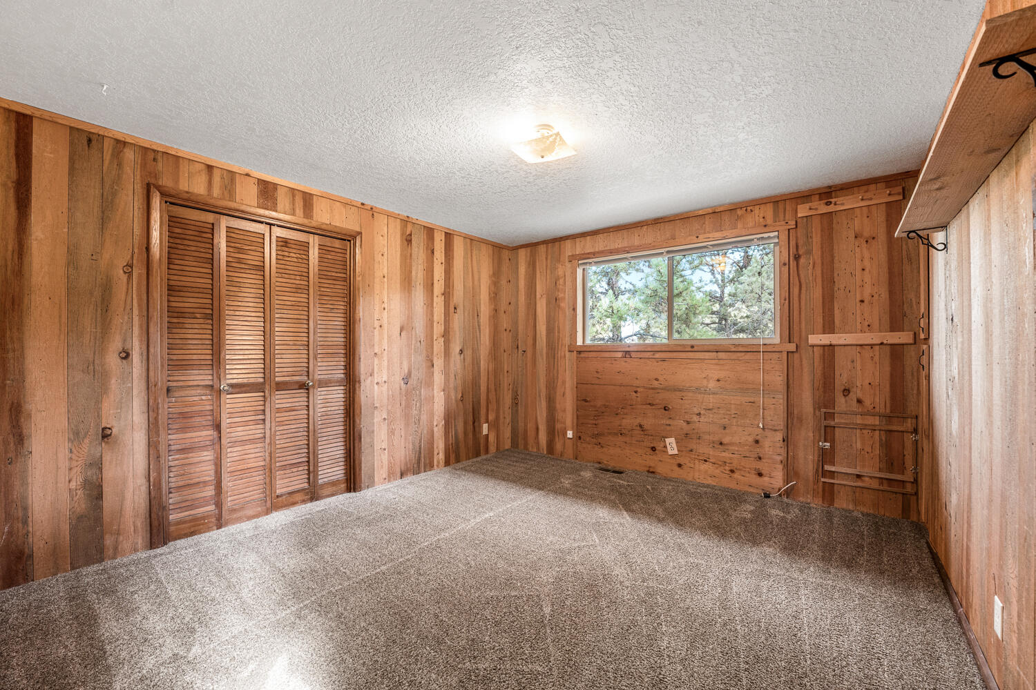 62255 Wallace Road Bend, OR 97701 - Photo 33 of 51 a view of an empty room with a window