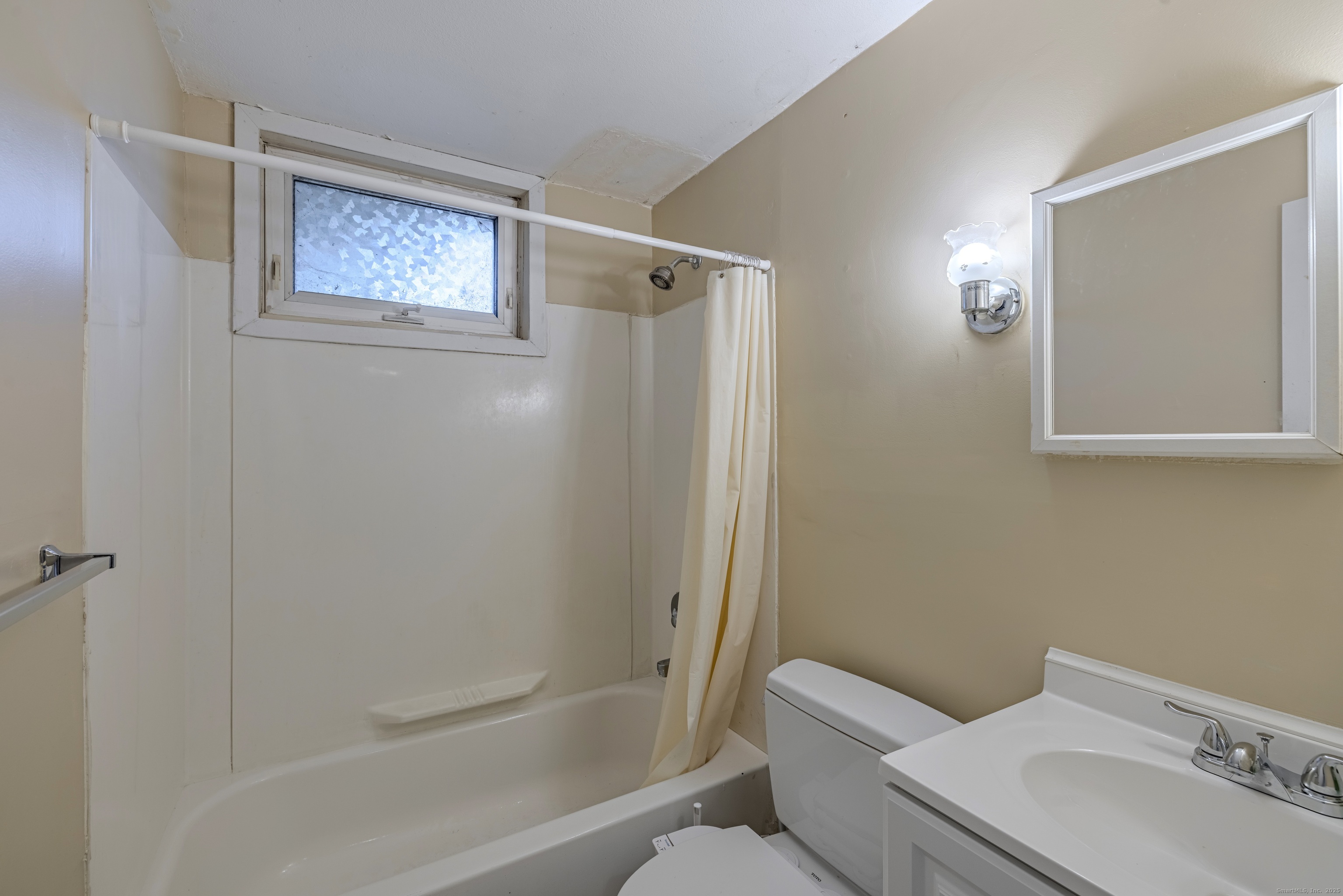 12 A White Oak Road, Unit 12A Mansfield, CT 06268 - Photo 12 of 24 a bathroom with a toilet sink and shower
