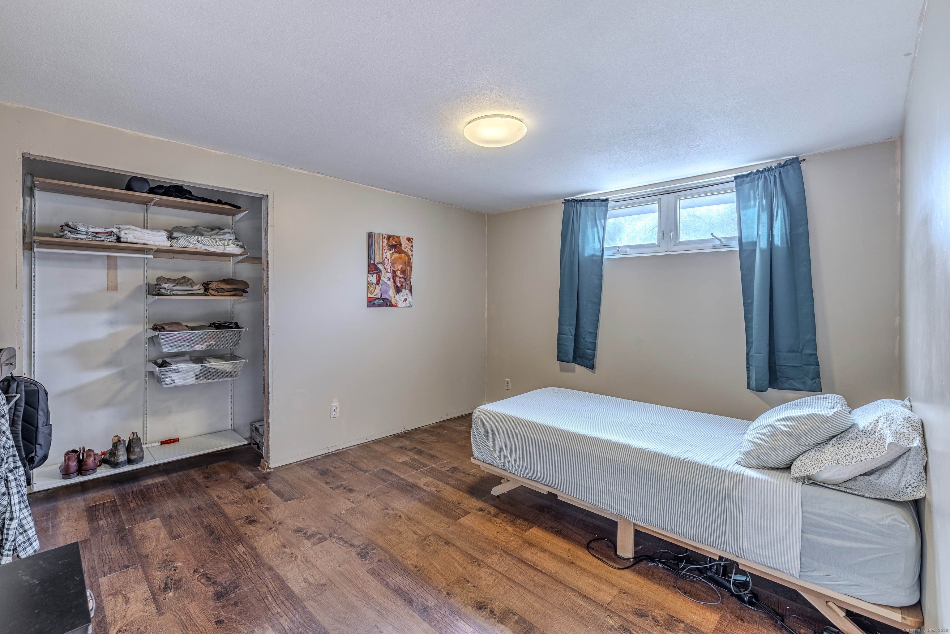 12 A White Oak Road, Unit 12A Mansfield, CT 06268 - Photo 14 of 24 a bedroom with a bed and a window