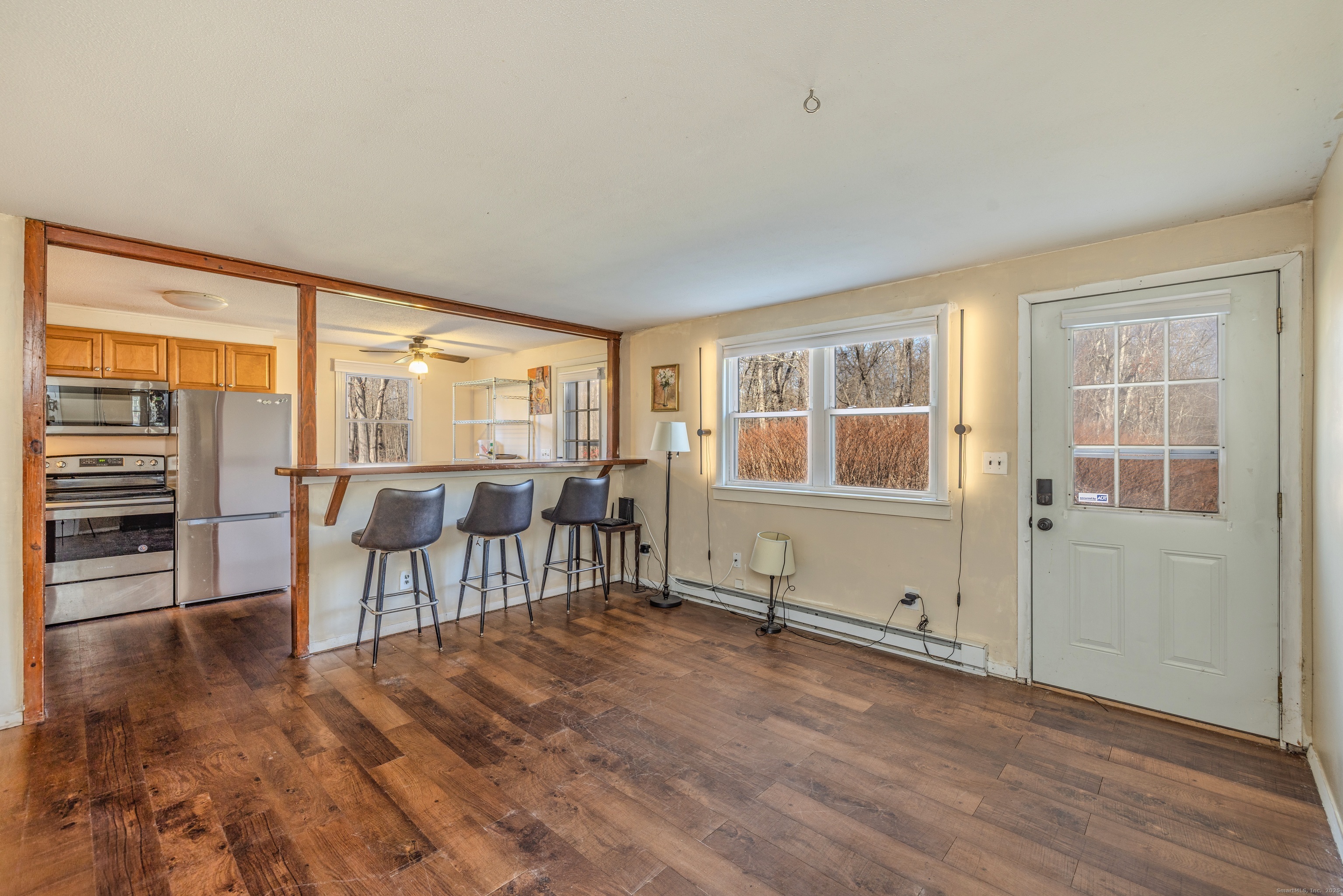 12 A White Oak Road, Unit 12A Mansfield, CT 06268 - Photo 5 of 24 an empty room with furniture and windows