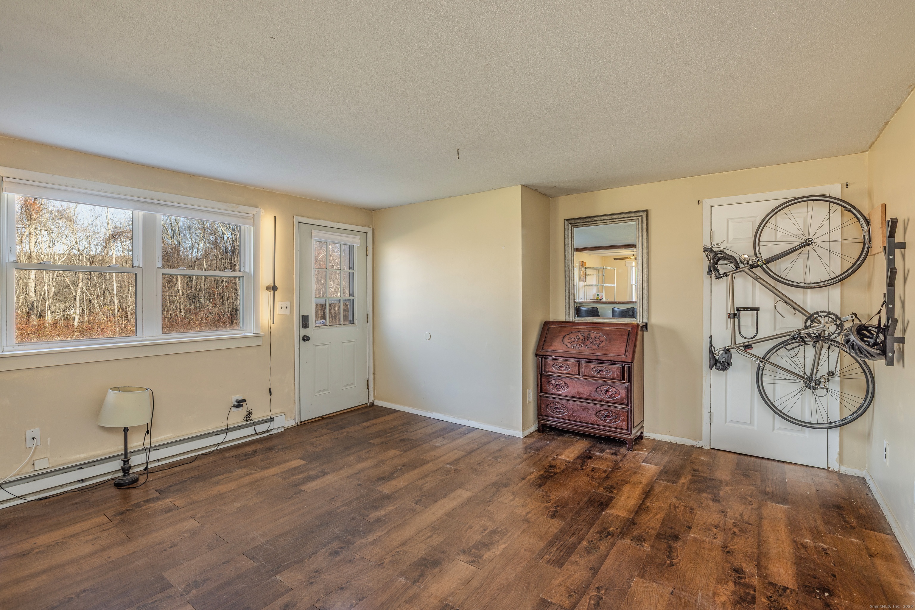 12 A White Oak Road, Unit 12A Mansfield, CT 06268 - Photo 7 of 24 a view of a room with window and wooden floor
