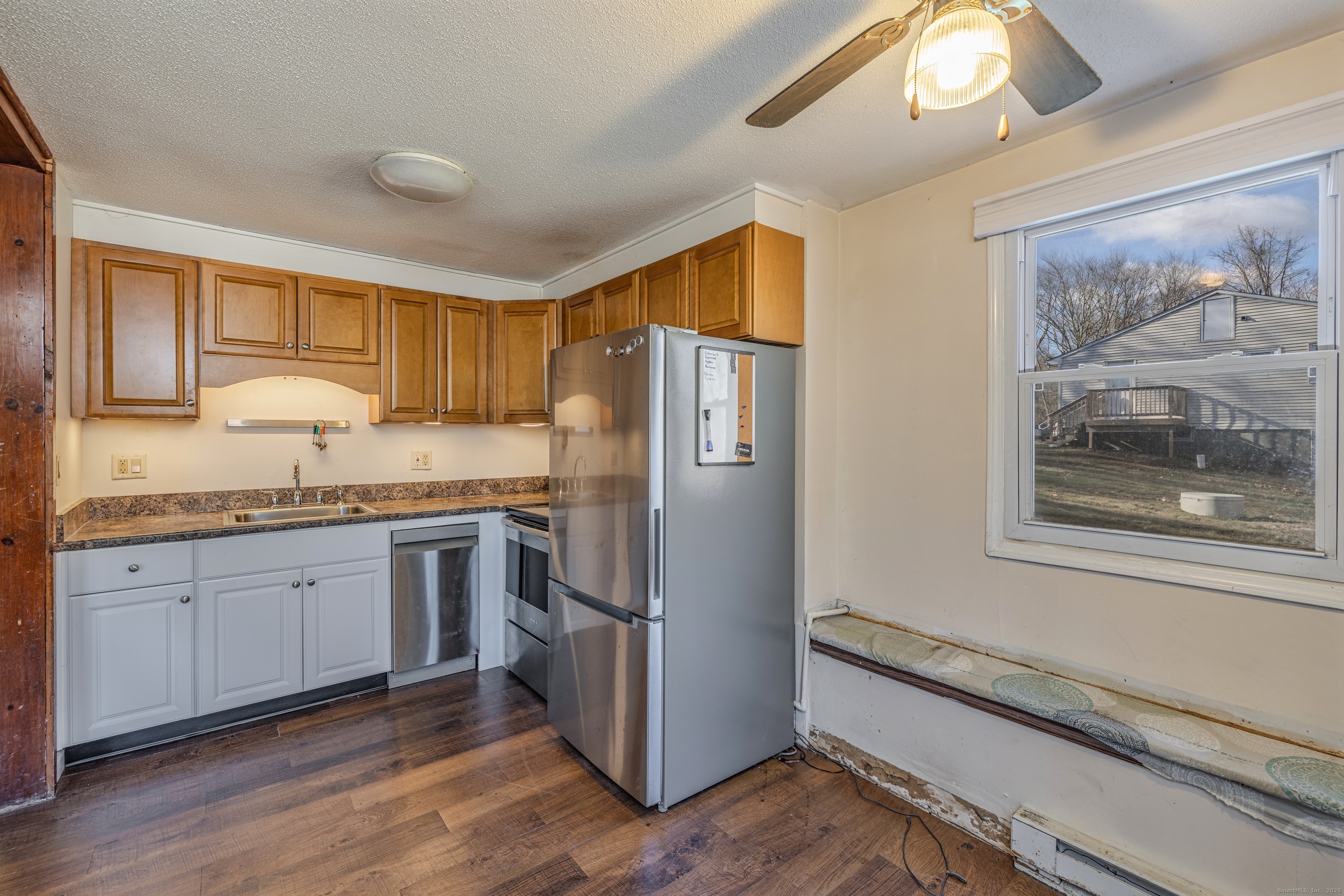 12 A White Oak Road, Unit 12A Mansfield, CT 06268 - Photo 9 of 24 a kitchen with granite countertop a refrigerator stove top oven and sink