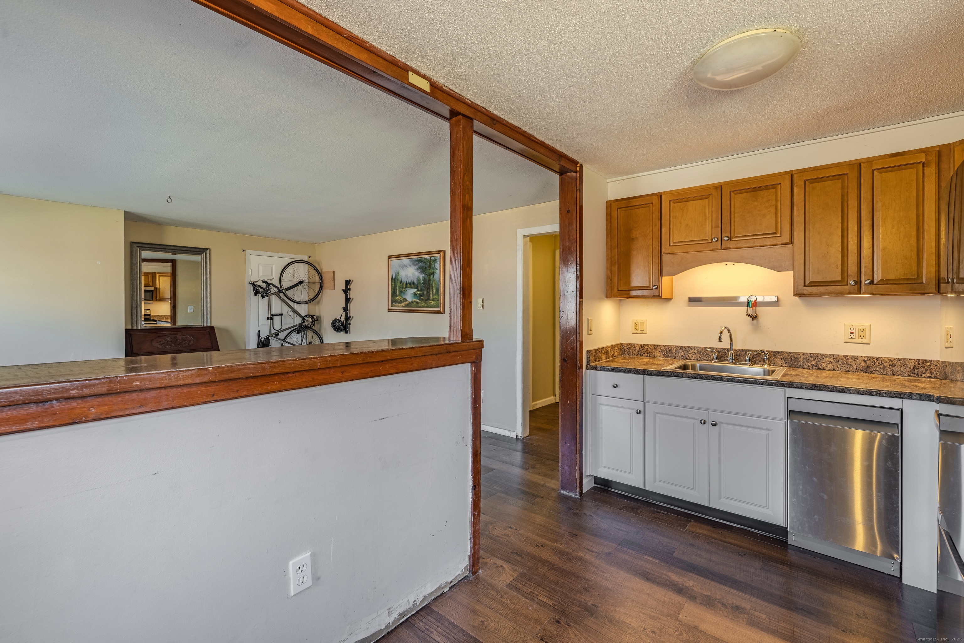 12 A White Oak Road, Unit 12A Mansfield, CT 06268 - Photo 10 of 24 a spacious bathroom with a granite countertop sink and a large mirror