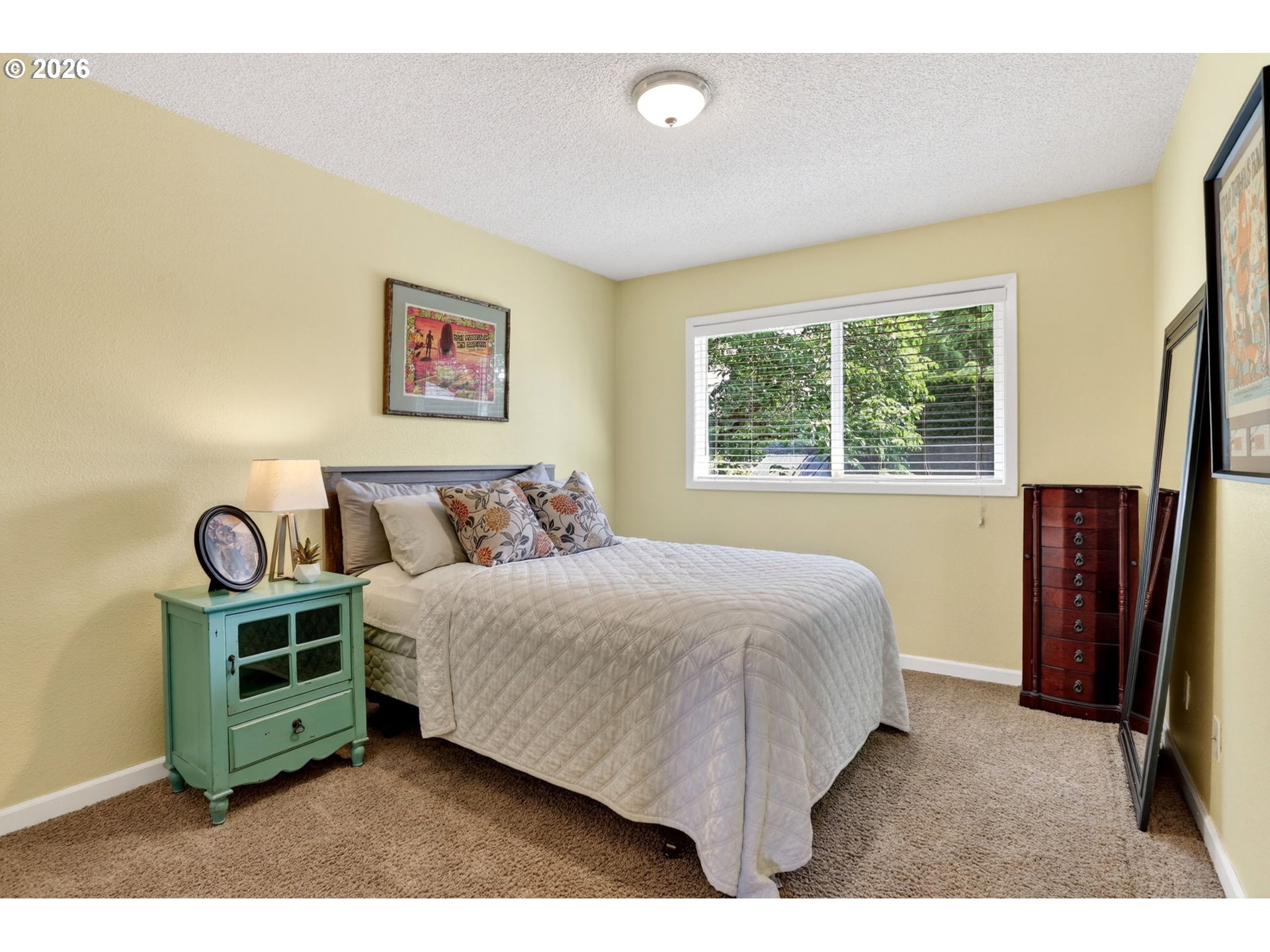 1776 Southeast 114th Place Portland, OR 97216 - Photo 36 of 47 a bedroom with a bed and a window