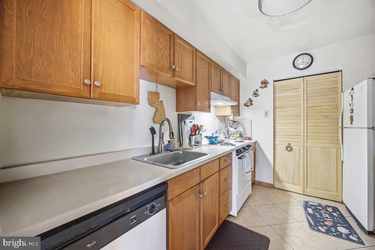 208 Timber Creek Road Lindenwold, NJ 08021 - Photo 2 of 12 a kitchen with a sink cabinets and window