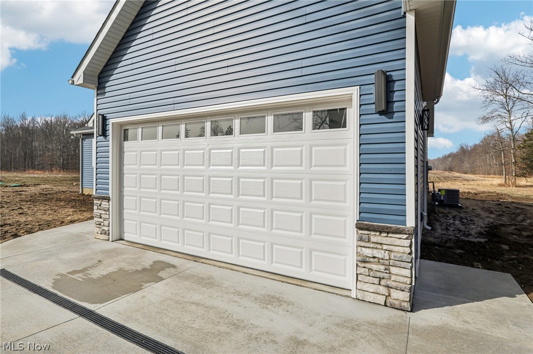 6535 North Ridge Road West Geneva, OH 44041 - Photo 44 of 48 Garage featuring concrete driveway