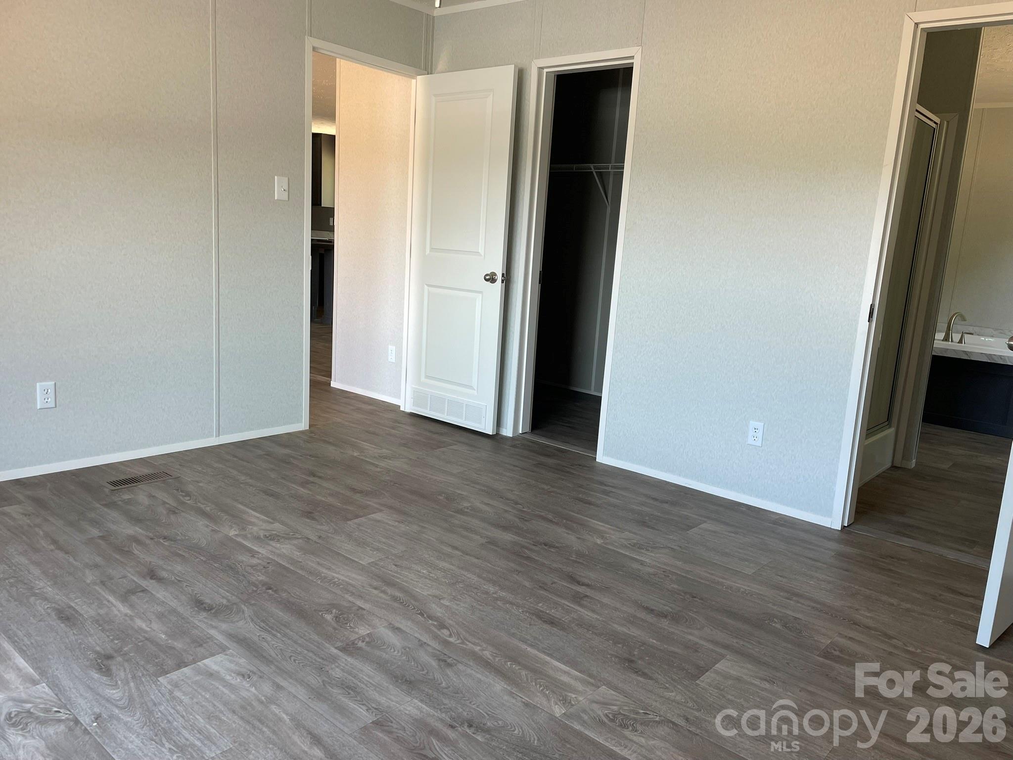 4188 Tallent Road Morganton, NC 28655 - Photo 14 of 21 an empty room with wooden floor and closet