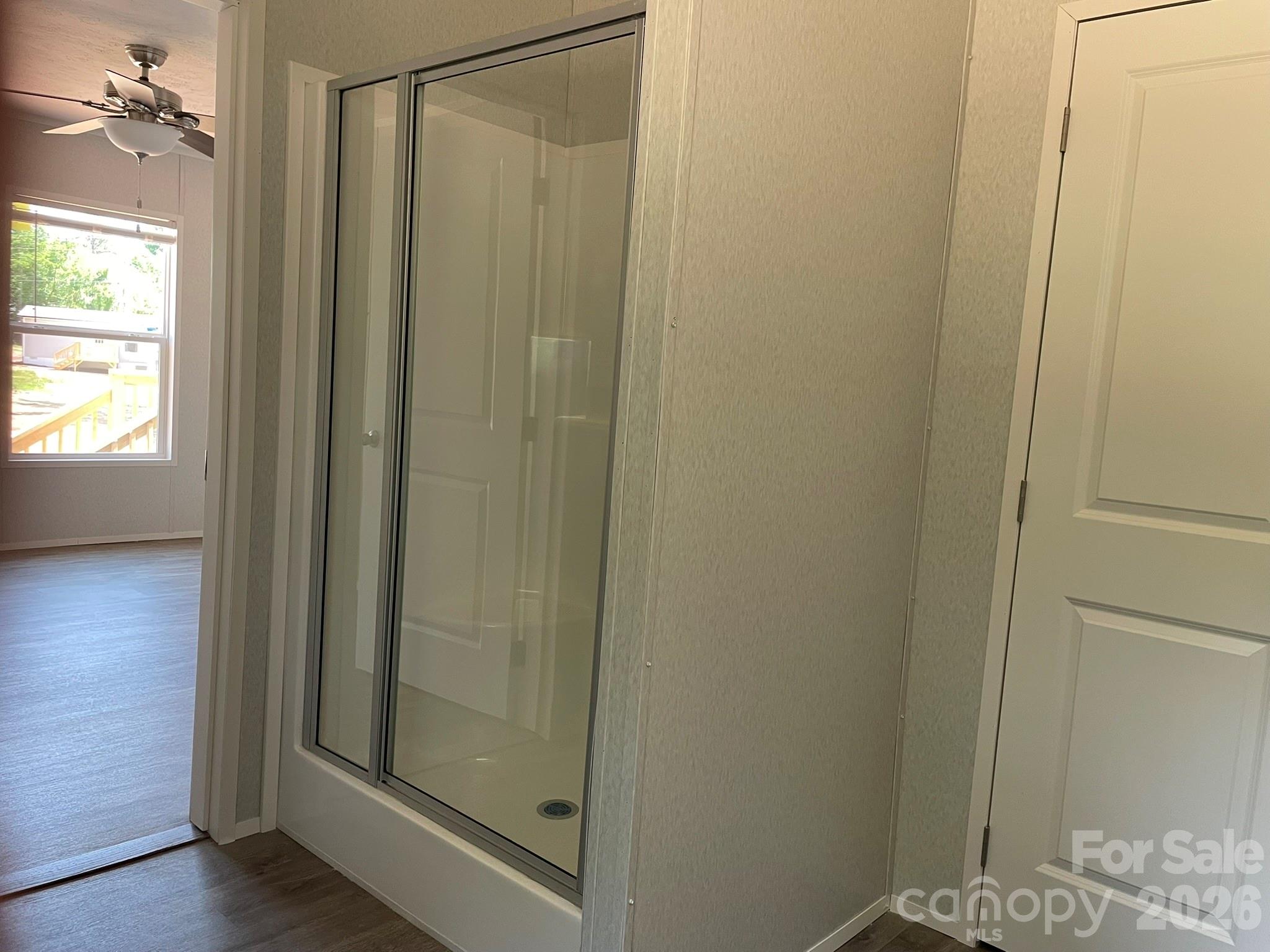 4188 Tallent Road Morganton, NC 28655 - Photo 18 of 21 a bathroom with a glass shower door