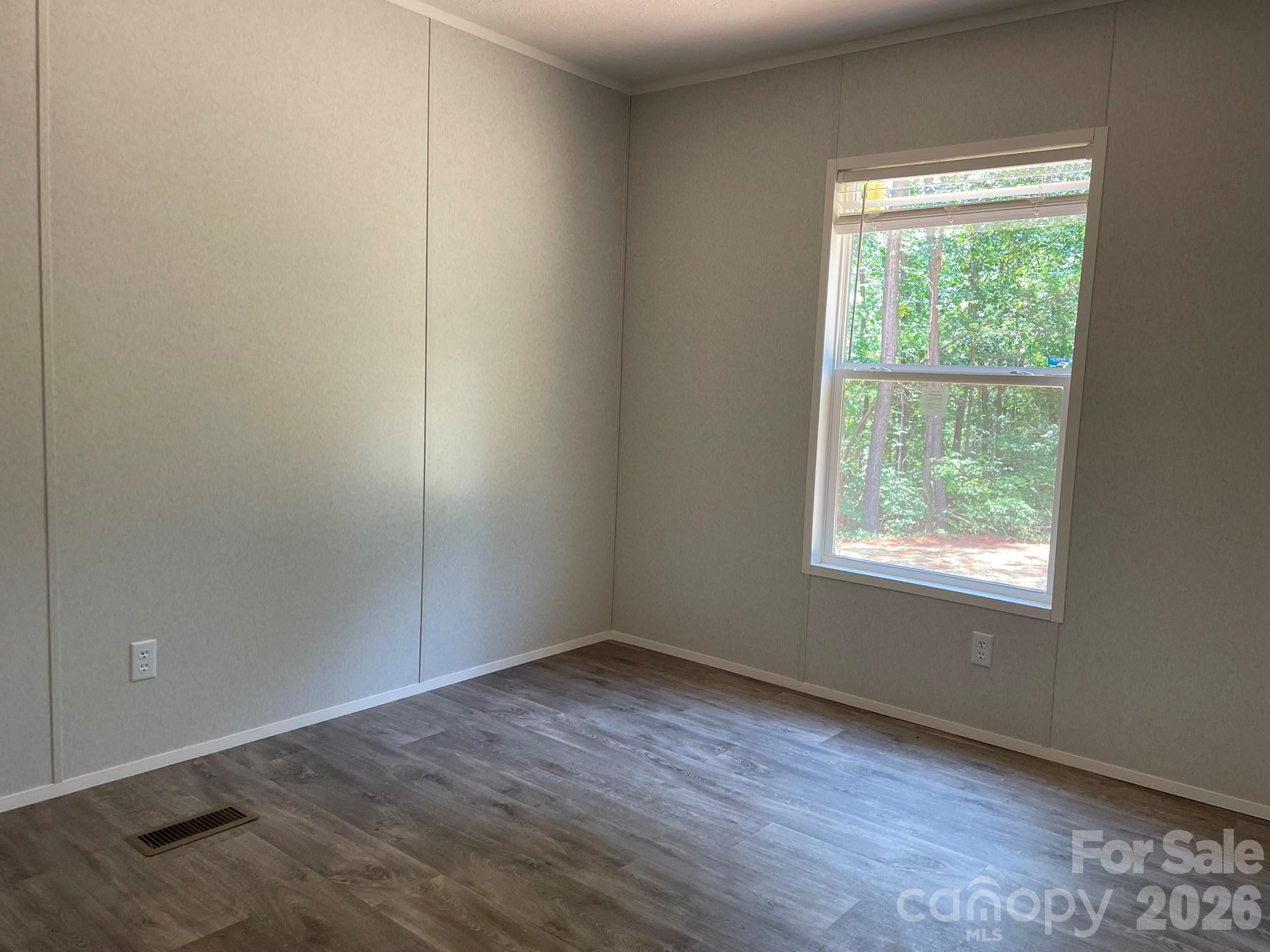 4188 Tallent Road Morganton, NC 28655 - Photo 19 of 21 an empty room with wooden floor and windows