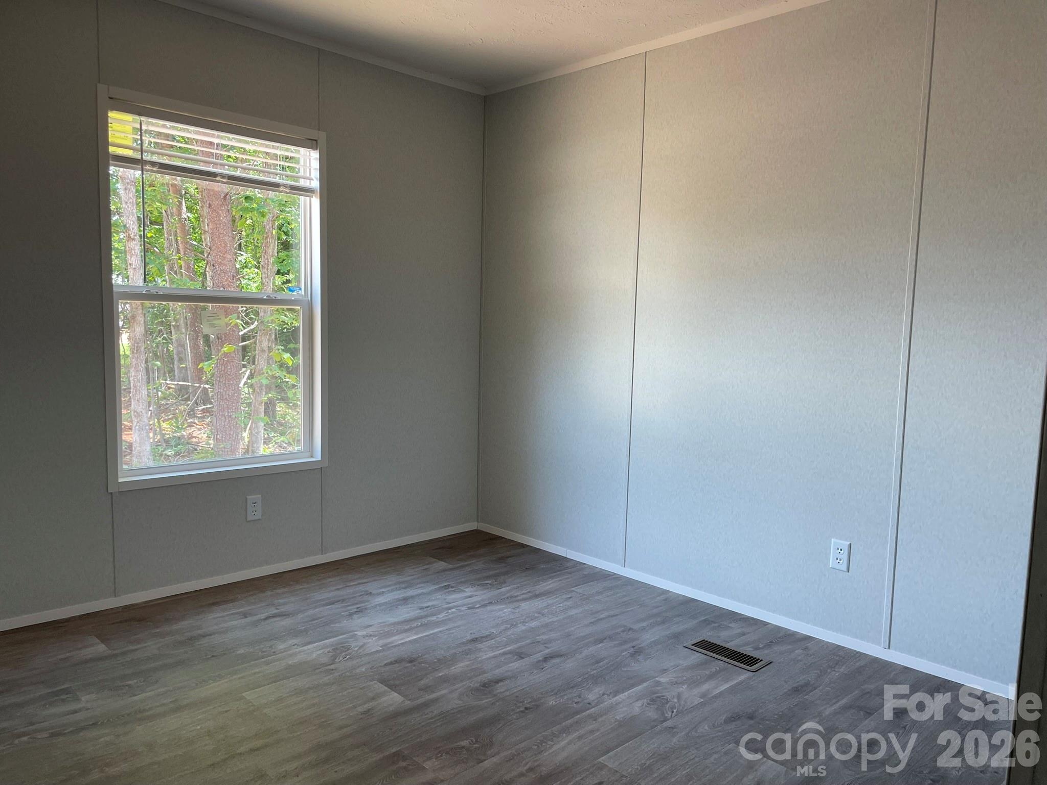 4188 Tallent Road Morganton, NC 28655 - Photo 20 of 21 a view of an empty room with wooden floor and a window