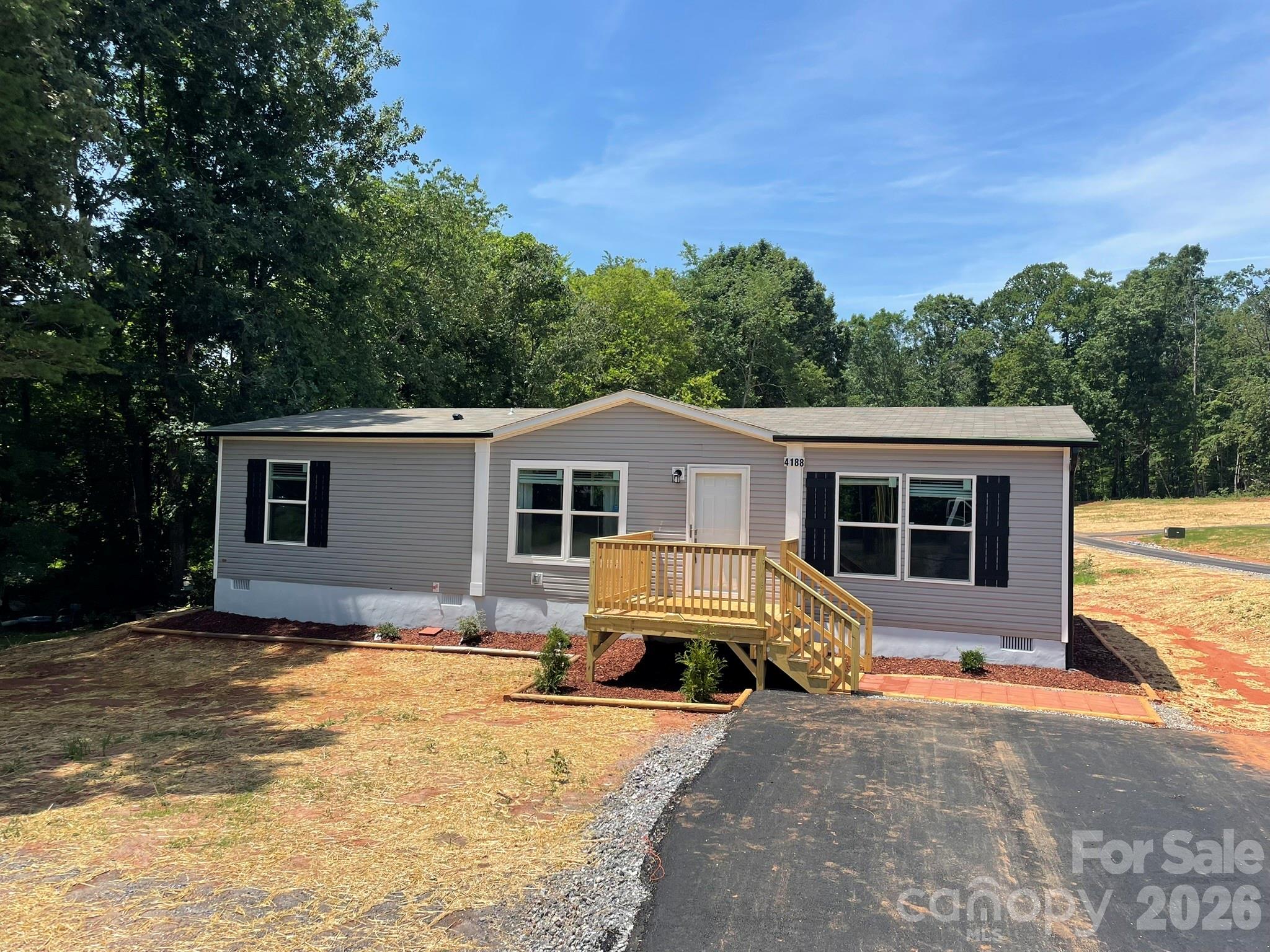 4188 Tallent Road Morganton, NC 28655 - Photo 2 of 21 a view of a house with snow on the background