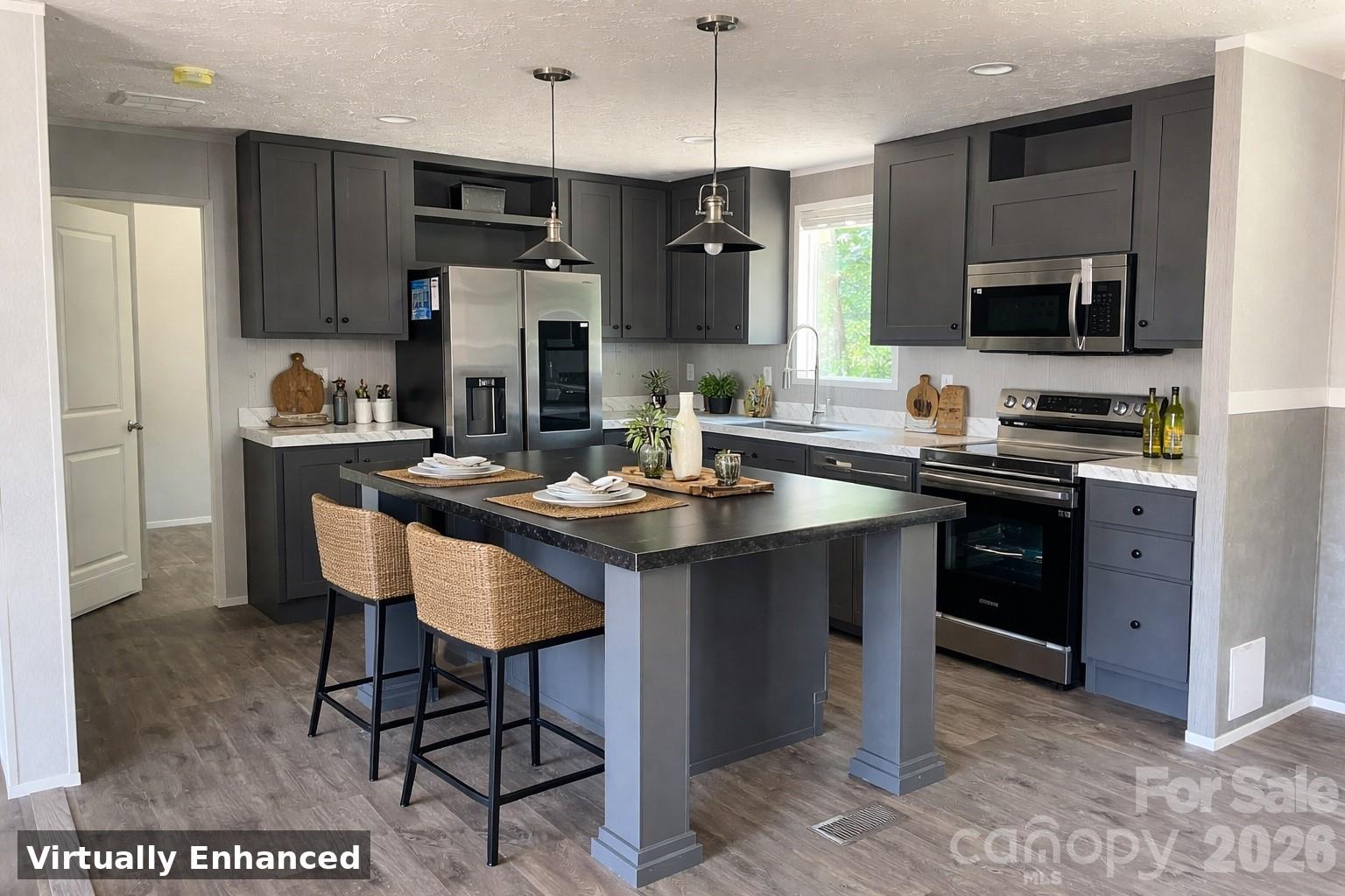 4188 Tallent Road Morganton, NC 28655 - Photo 5 of 21 a kitchen with stainless steel appliances granite countertop a sink stove a refrigerator and a microwave