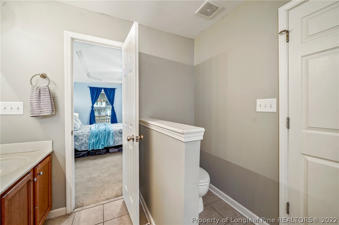 85 Pender Road Spring Lake, NC 28390 - Photo 21 of 45 a bathroom with a sink a toilet and shower