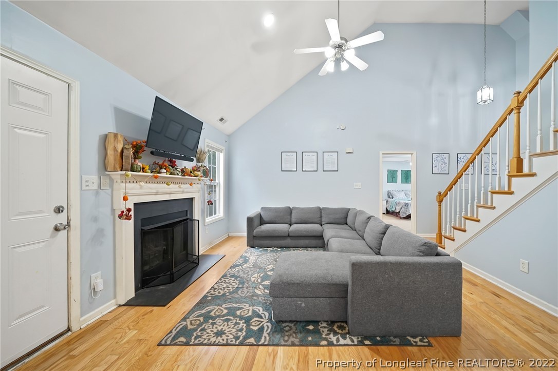 85 Pender Road Spring Lake, NC 28390 - Photo 7 of 45 a living room with furniture a fireplace and a flat screen tv