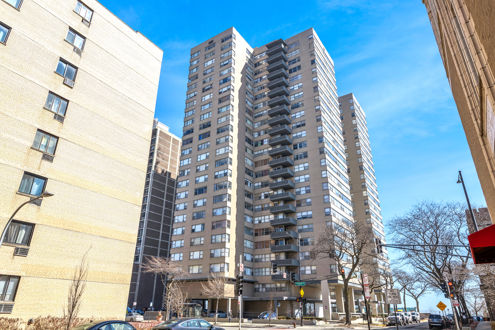 6301 North Sheridan Road, Unit 23J Chicago, IL 60660 - Photo 1 of 21 front view of a tall building
